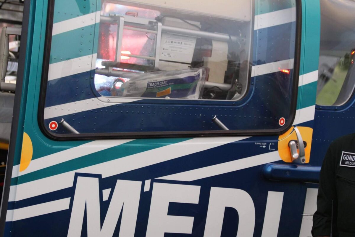 Close-up view of a part of a helicopter featuring the word 